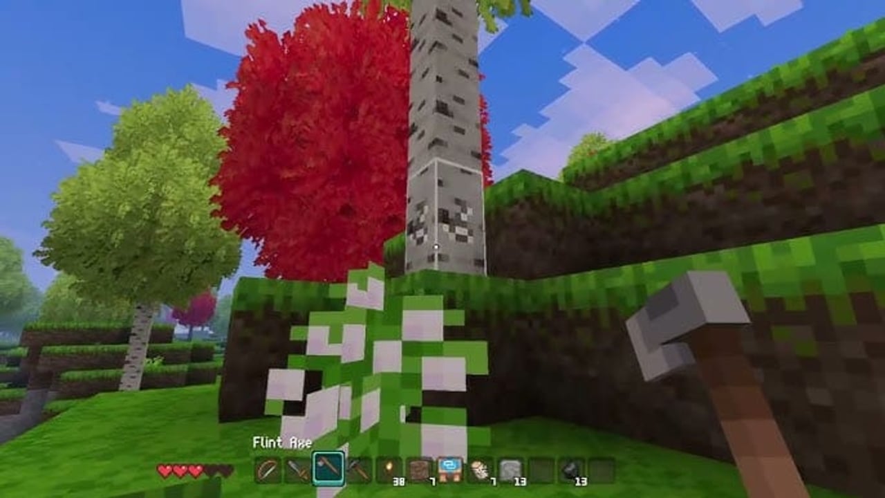 Allumeria player chopping a birch tree in a voxel forest